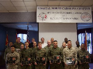 Communicator of the Year award winners gather at the January conference and exhibition breakfast at which they honored for top perfomances.